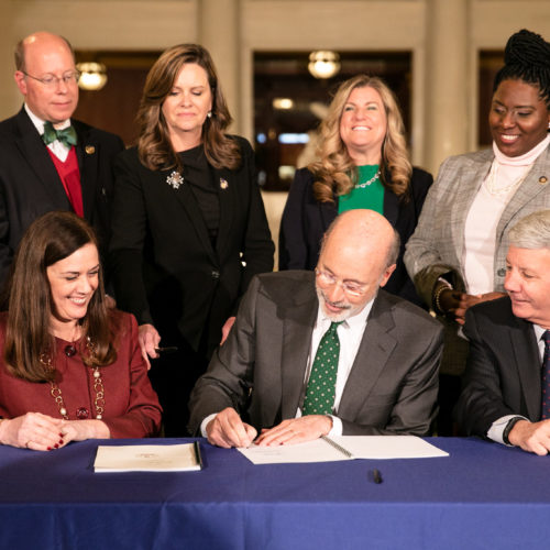 Photo of bill signing.