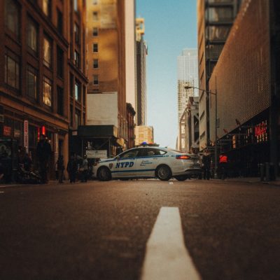 police car in between buildings