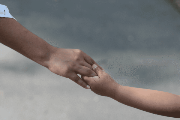 Parent and child holding hands