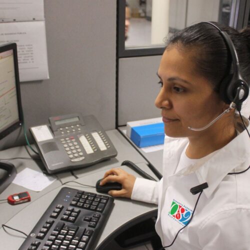 woman answering emergency calls