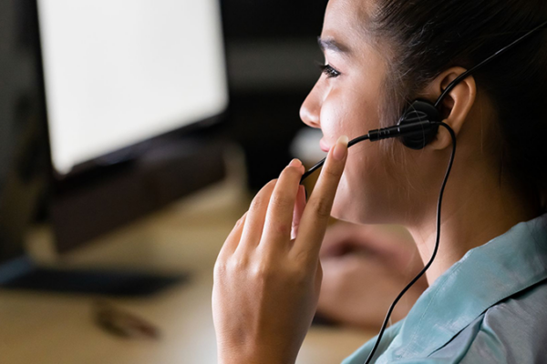 woman answering call - Canva