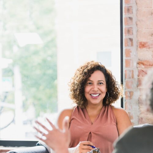 A female case manager speaks to a client