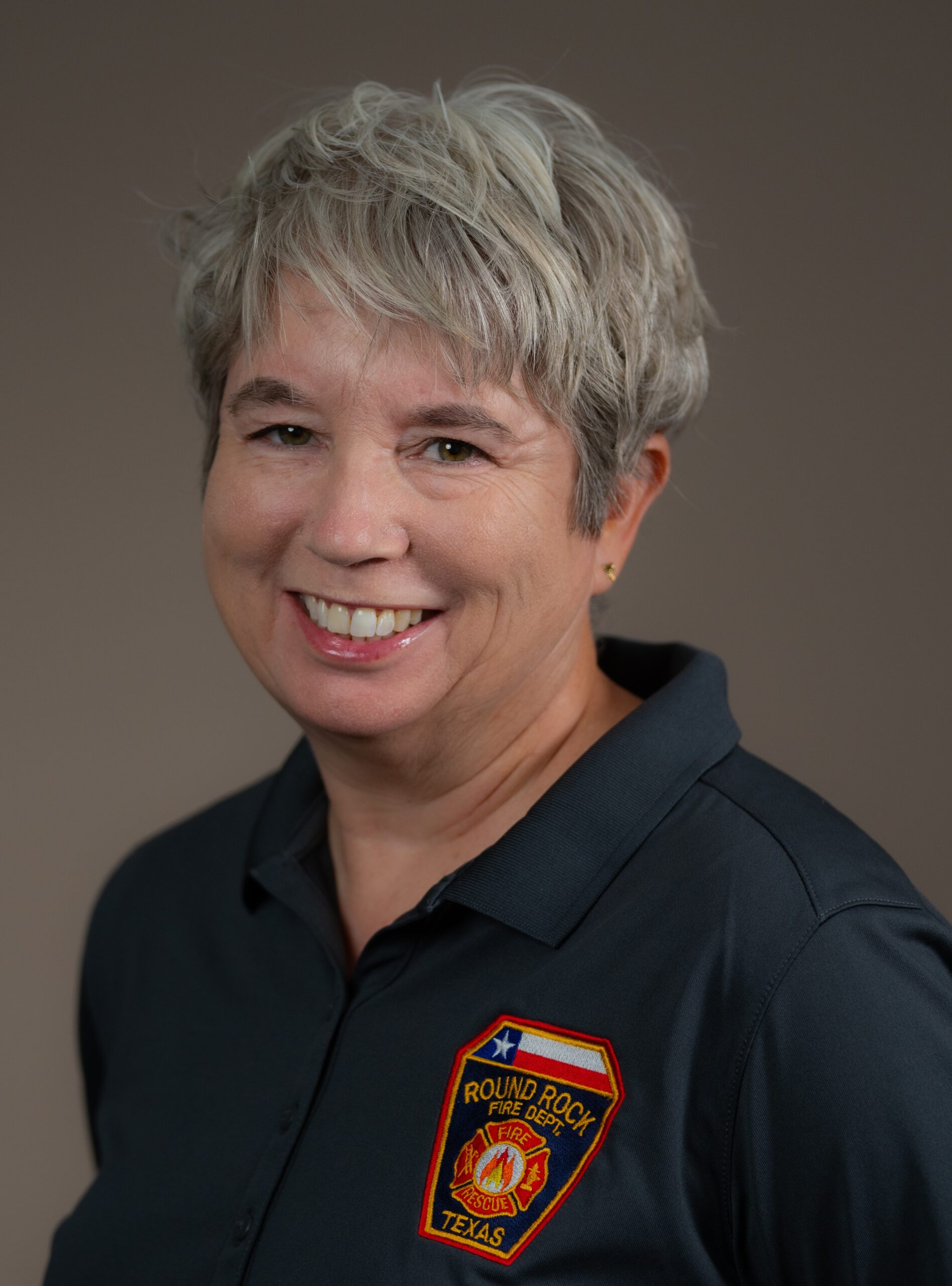 headshot of Annie Burwell, Commission member and program manager of a Crisis Response Unit in Round Rock, Texas