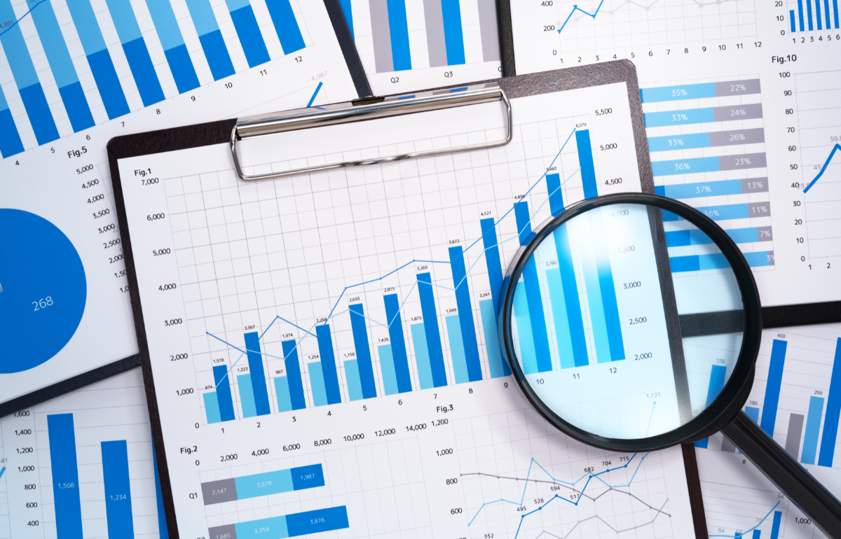 growth charts and magnifying glass