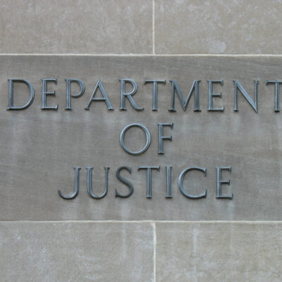 Department of Justice sign on building