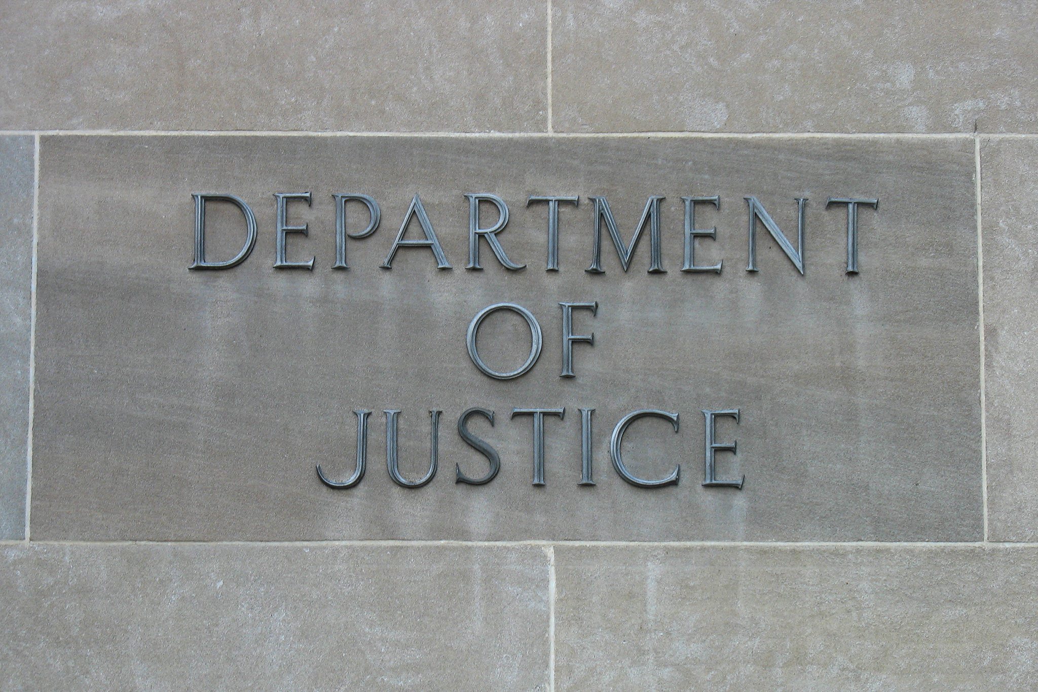 Department of Justice sign on building